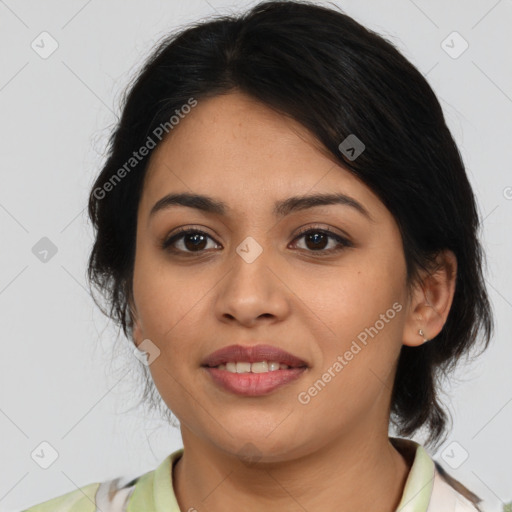 Joyful latino young-adult female with medium  brown hair and brown eyes