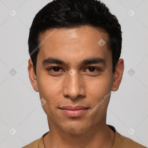 Joyful latino young-adult male with short  black hair and brown eyes