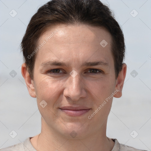 Joyful white young-adult female with short  brown hair and grey eyes