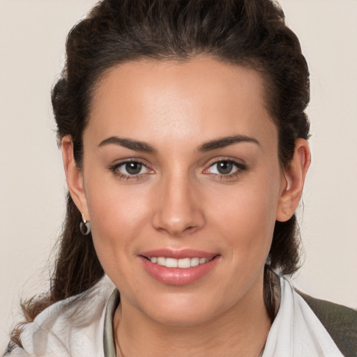 Joyful white young-adult female with medium  brown hair and brown eyes