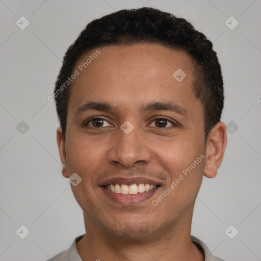 Joyful latino young-adult male with short  brown hair and brown eyes