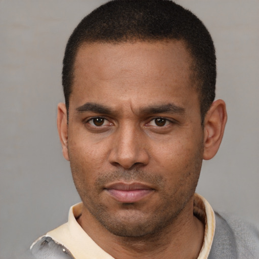 Neutral latino adult male with short  black hair and brown eyes