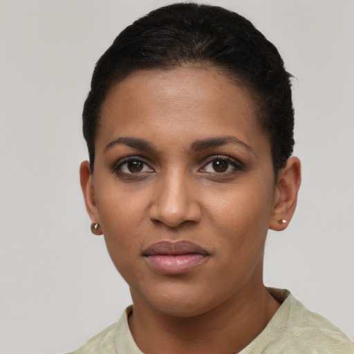 Joyful black young-adult female with short  brown hair and brown eyes