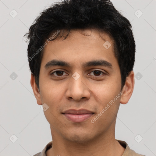 Joyful latino young-adult male with short  black hair and brown eyes