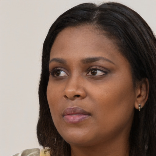 Neutral black young-adult female with long  brown hair and brown eyes