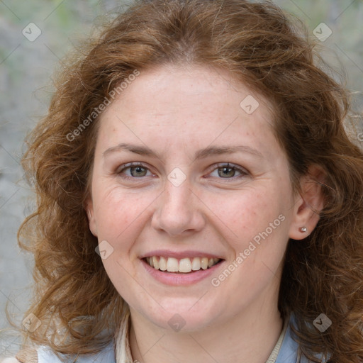 Joyful white young-adult female with medium  brown hair and blue eyes