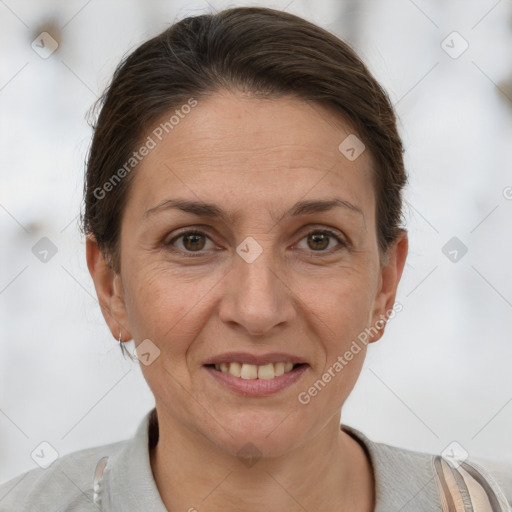 Joyful white adult female with short  brown hair and brown eyes