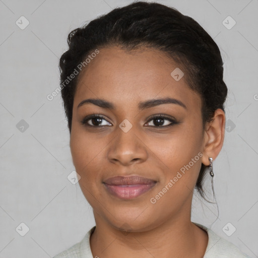 Joyful black young-adult female with short  black hair and brown eyes