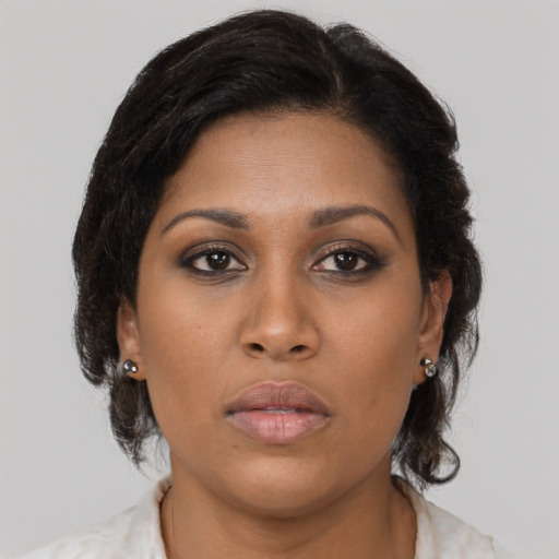 Neutral black young-adult female with medium  brown hair and brown eyes