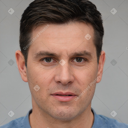 Joyful white adult male with short  brown hair and brown eyes