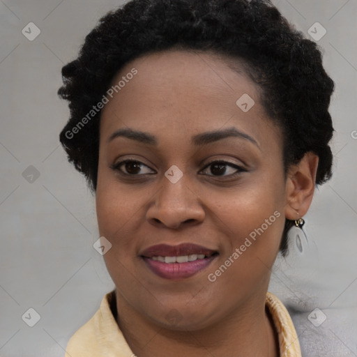 Joyful black young-adult female with short  brown hair and brown eyes