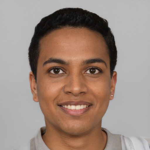 Joyful latino young-adult male with short  black hair and brown eyes