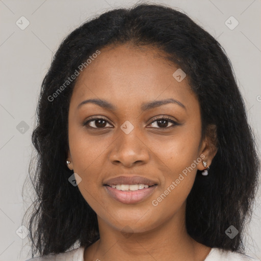 Joyful black young-adult female with long  brown hair and brown eyes