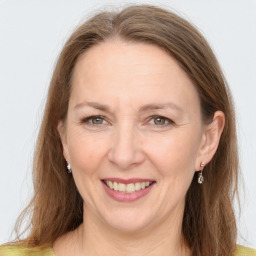 Joyful white adult female with long  brown hair and grey eyes