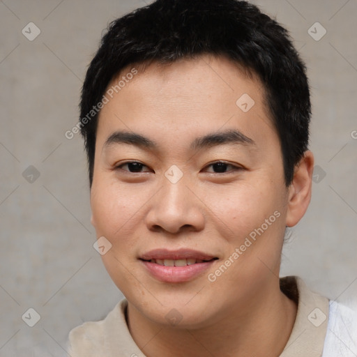 Joyful asian young-adult male with short  brown hair and brown eyes