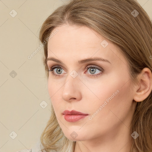 Neutral white young-adult female with long  brown hair and blue eyes