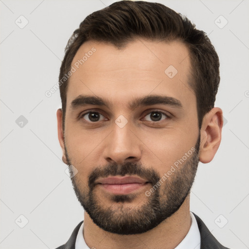 Neutral white young-adult male with short  brown hair and brown eyes