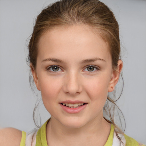 Joyful white child female with medium  brown hair and brown eyes