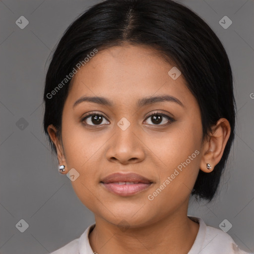 Joyful latino young-adult female with medium  brown hair and brown eyes