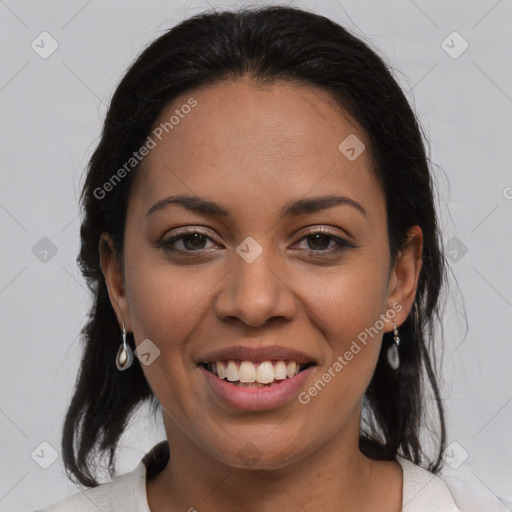 Joyful latino young-adult female with medium  brown hair and brown eyes