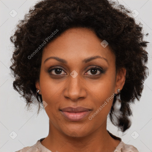 Joyful black young-adult female with medium  brown hair and brown eyes