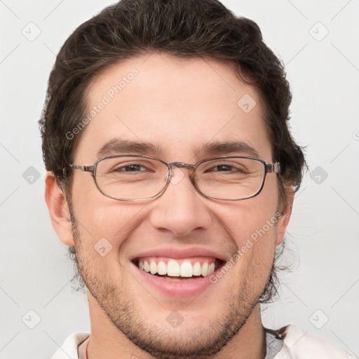 Joyful white adult male with short  brown hair and grey eyes