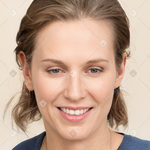 Joyful white young-adult female with medium  brown hair and blue eyes