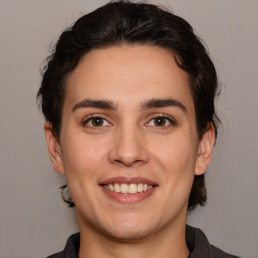 Joyful white young-adult male with medium  brown hair and brown eyes