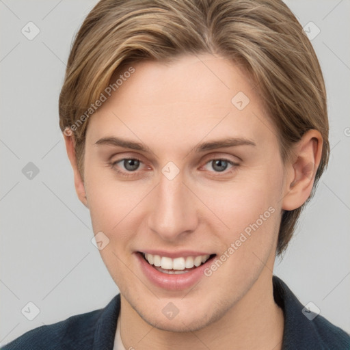 Joyful white young-adult female with short  brown hair and grey eyes