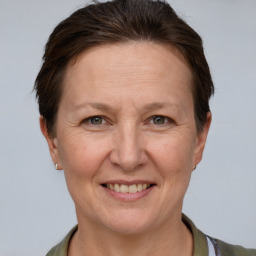 Joyful white adult female with short  brown hair and grey eyes