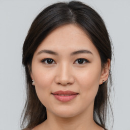 Joyful asian young-adult female with medium  brown hair and brown eyes