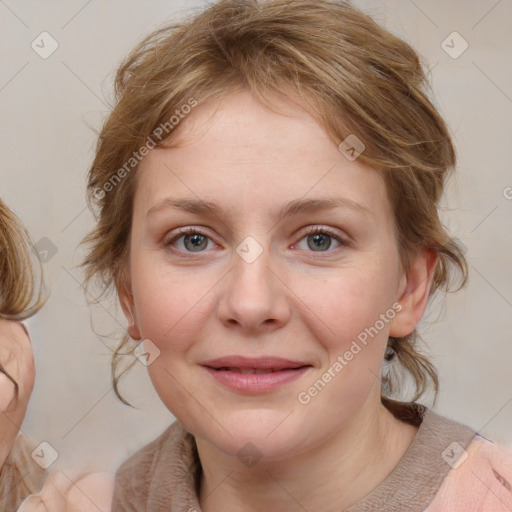 Joyful white young-adult female with medium  brown hair and blue eyes