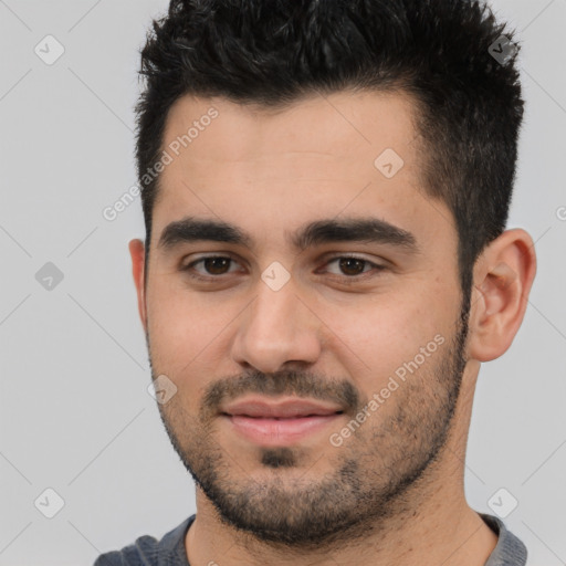 Joyful white young-adult male with short  black hair and brown eyes