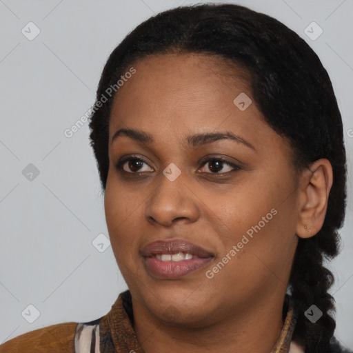 Joyful black young-adult female with short  black hair and brown eyes