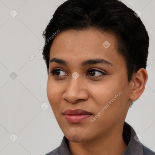 Joyful latino young-adult female with short  black hair and brown eyes