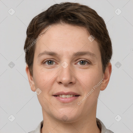 Joyful white young-adult female with short  brown hair and grey eyes