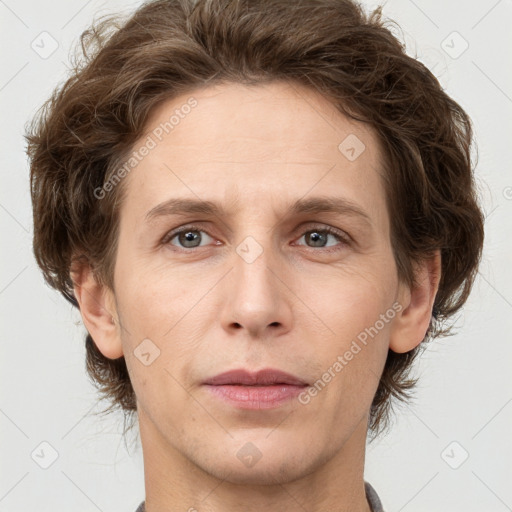 Joyful white adult female with short  brown hair and grey eyes