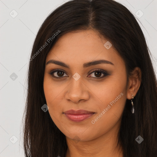 Joyful latino young-adult female with long  brown hair and brown eyes