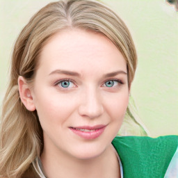 Joyful white young-adult female with long  brown hair and green eyes