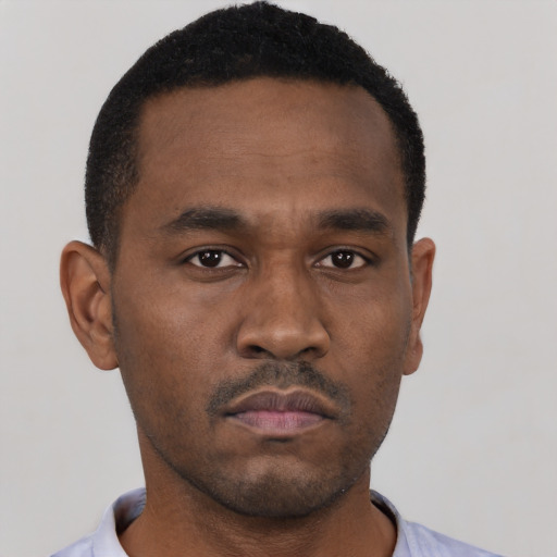 Neutral black young-adult male with short  black hair and brown eyes