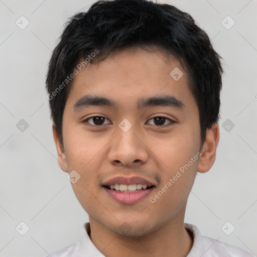 Joyful asian young-adult male with short  black hair and brown eyes