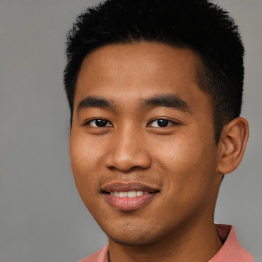 Joyful asian young-adult male with short  black hair and brown eyes