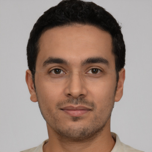 Neutral latino young-adult male with short  black hair and brown eyes