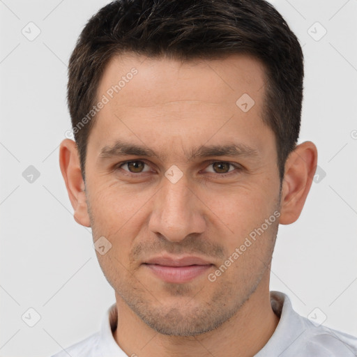 Joyful white adult male with short  brown hair and brown eyes