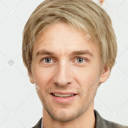 Joyful white adult male with short  brown hair and grey eyes