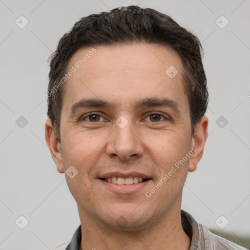 Joyful white adult male with short  brown hair and brown eyes