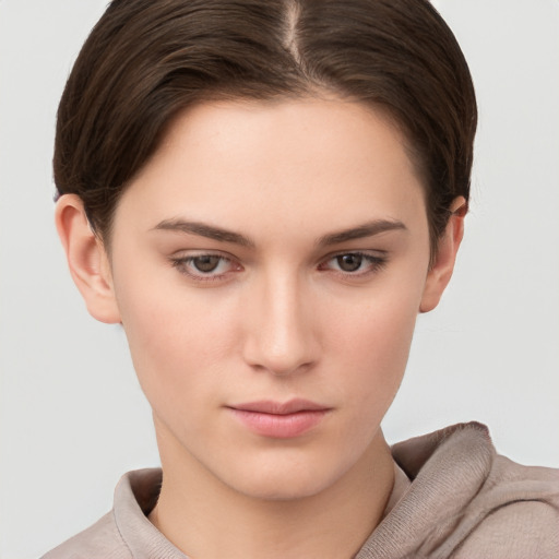 Neutral white young-adult female with short  brown hair and brown eyes