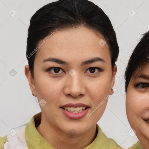 Joyful asian young-adult female with short  brown hair and brown eyes