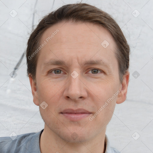 Joyful white adult male with short  brown hair and grey eyes