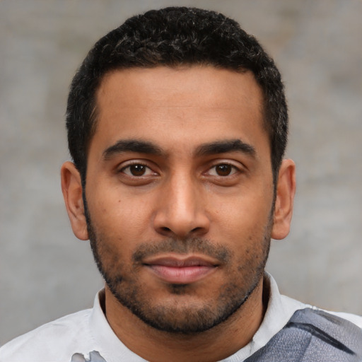 Neutral latino young-adult male with short  black hair and brown eyes